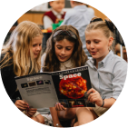 students reading a space book