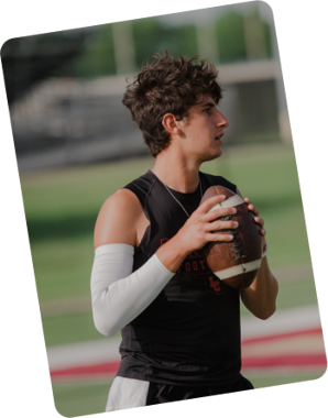 student holding a football