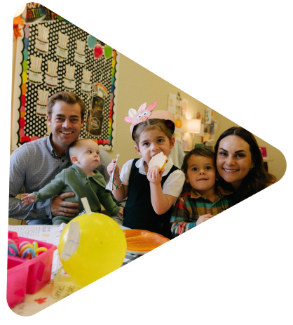 family inside a lincoln christian school classroom