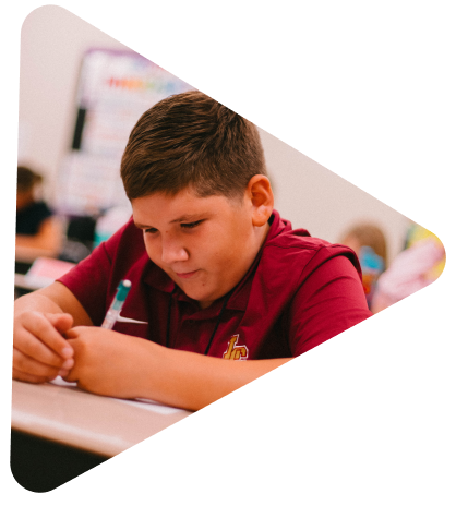 young boy writing
