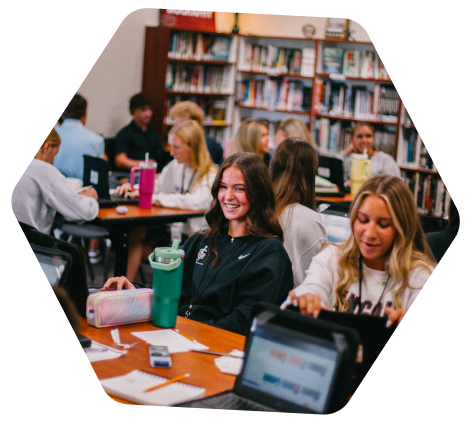 girls sitting in a school library