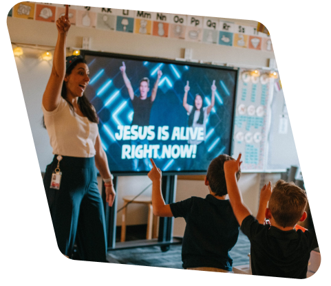 elementary school teacher doing worship with her students