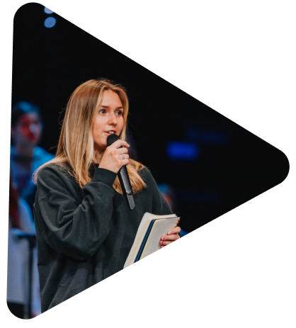 student speaking into a microphone