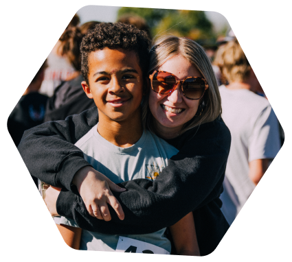 teacher hugging a student