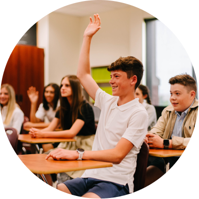 student raising his hand